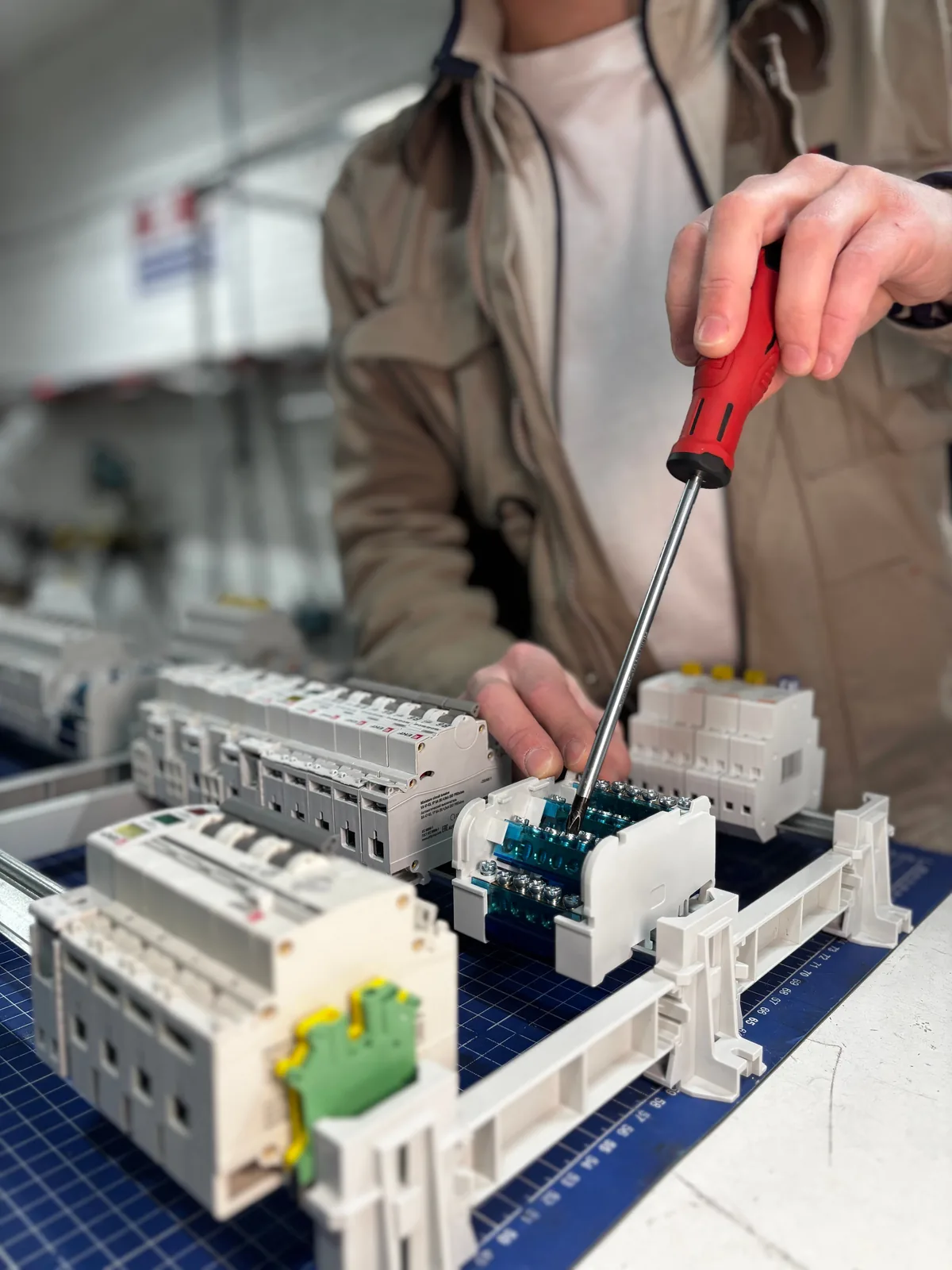 Breakers assembled on a DIN rail before installation, for subpanel installation in Surrey