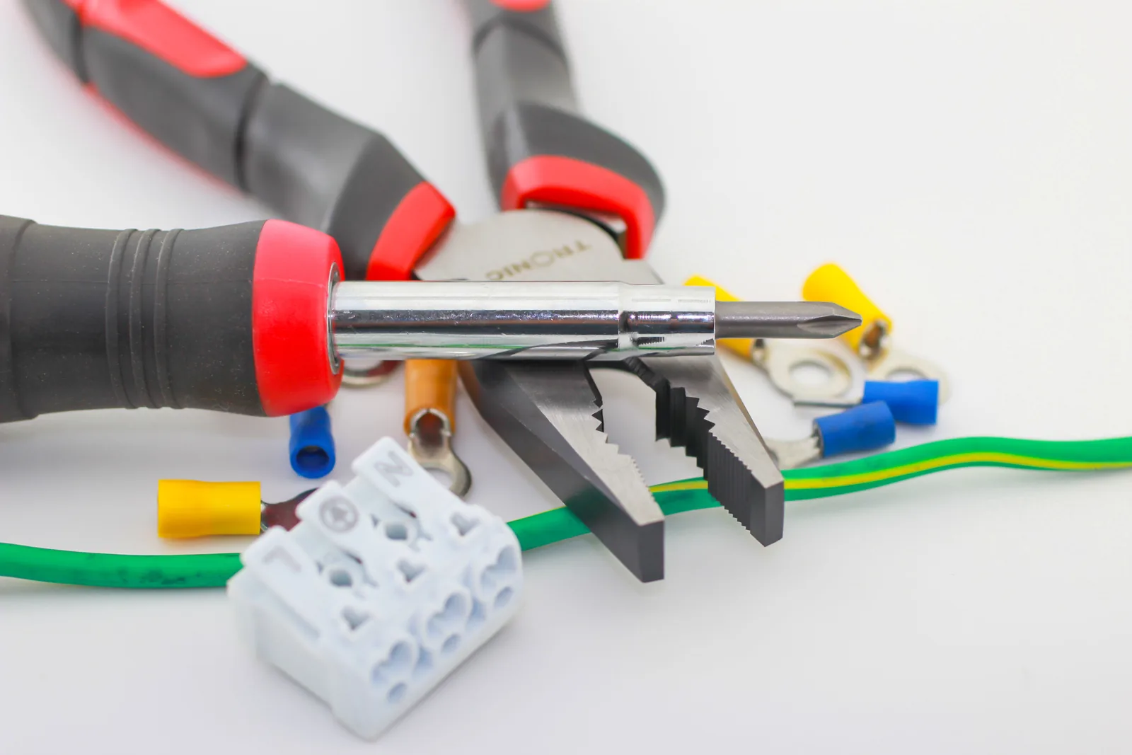 Pliers, a screwdriver, ferrules and a connector block, for electrician in Surrey