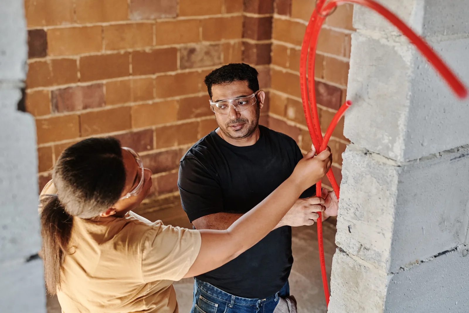 Running conduit across a block wall, for ev rebate in Surrey