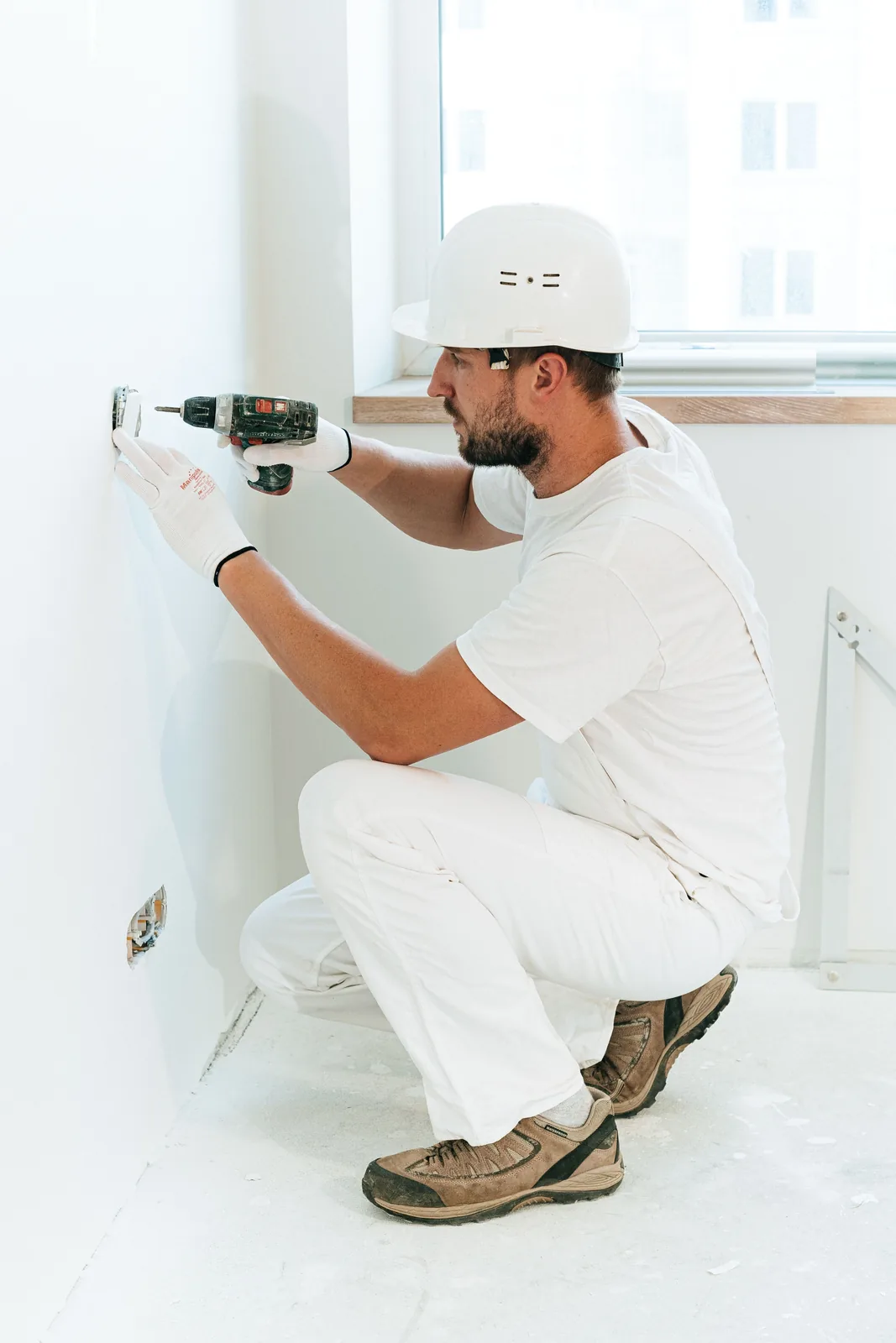 Fixing a socket into a finished wall, for electrician in Surrey